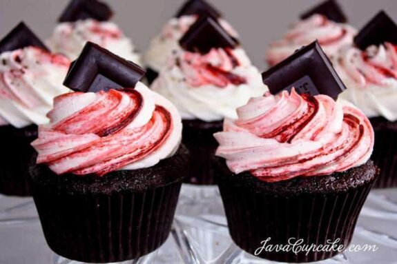 Dark Chocolate Raspberry Curd Filled Cupcakes with a chunk of german chocolate on top