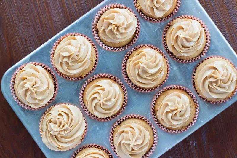A dozen Peanut Butter Cupcakes fresh from the oven