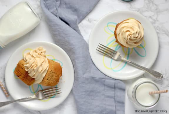 Peanut Butter Cupcakes served on white dishes with a glass of milk
