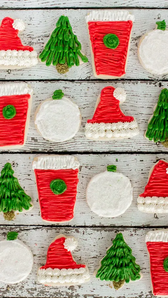 Traditional sugar cookies frosted with buttercream and dressed up for the holiday make these Frosted Sugar Cookies the perfect Christmas treat!