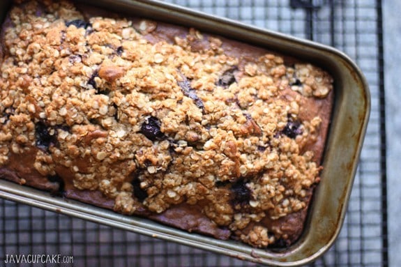 Freshly baked Blueberry Banana Bread, it is being cooled in the tin, sitting on a wore rack, until the time comes to remove it.
