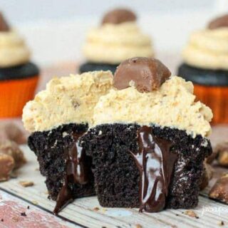 Deluxe Butterfinger Cupcakes - Rich chocolate cake filled with creamy chocolate ganache topped with decadent peanut butter Butterfinger buttercream and a chocolate Butterfinger candy. A Butterfinger lovers dream! | JavaCupcake.com