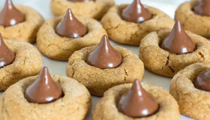 Deluxe Cookie Butter Blossoms - A cookie butter based dough rolled in turbinado sugar and topped giant hazelnut filled chocolates. | JavaCupcake.com